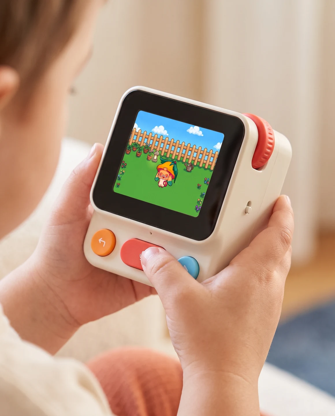Close-up of a child holding Nowa with a pet on its screen